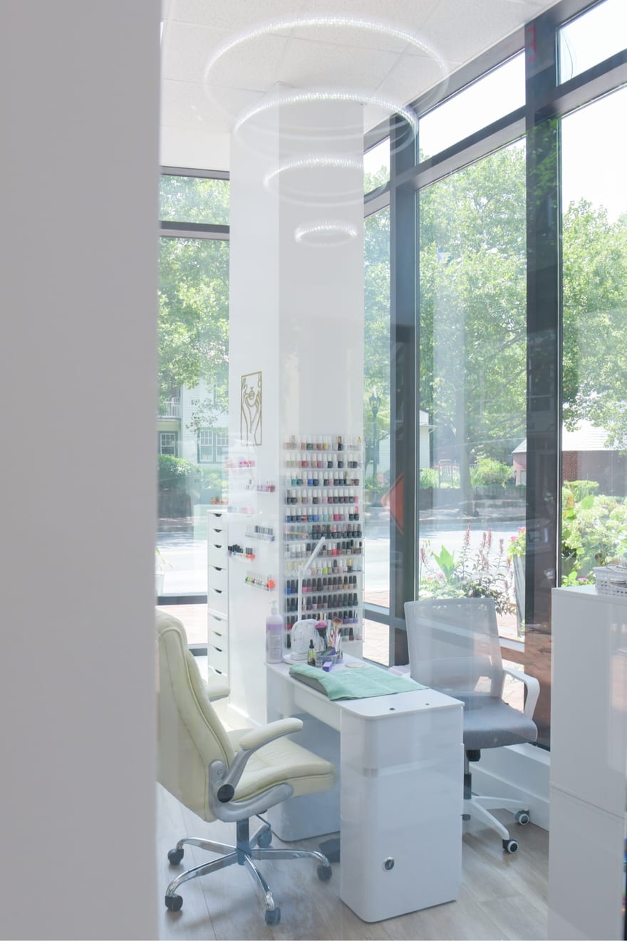 A nail suite at the Bethesda location, furnished and branded by the professional who leases it.